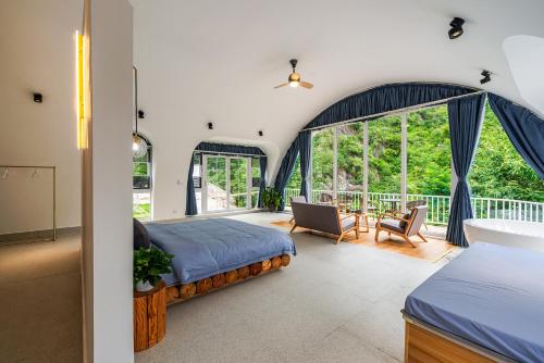 Ένα ή περισσότερα κρεβάτια σε δωμάτιο στο Starstay Wuling Mountain B&B