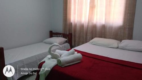 Säng eller sängar i ett rum på Pousada Canto das Araras - Vila Bom Jardim Nobres MT