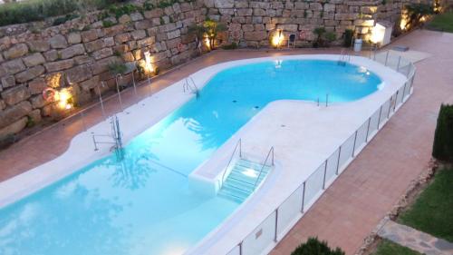 an overhead view of a large swimming pool at night at Dream Apartment in Mijas Golf Limonar in Mijas Costa
