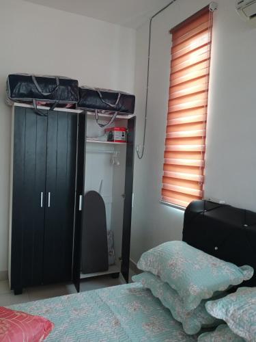 a bedroom with a bed and a bunk bed at MY KIJANG HOMESTAY - Banglo, Alor Setar Kedah DarulAman in Alor Setar