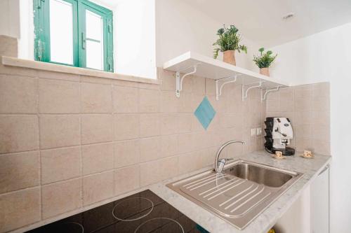 A kitchen or kitchenette at White Amalfi Centro Storico by ItalianHost