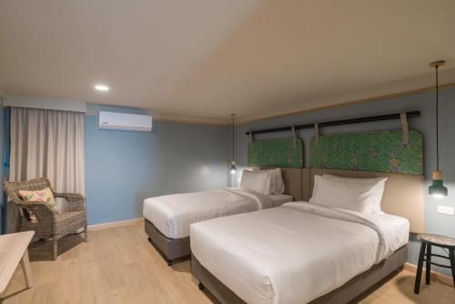 Postel nebo postele na pokoji v ubytování The Blanket Hotel Phuket Old Town