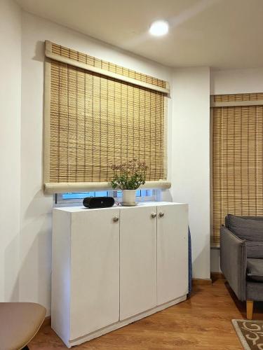 a room with a white cabinet and a window at Ananya Apartments Phase 2 in Kathmandu