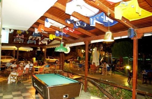 a pool table in the middle of a restaurant at Canditas Studios in Tsilivi