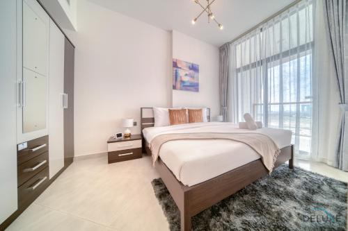 Postel nebo postele na pokoji v ubytování Splendid 1BR at Binghatti Avenue Al Jaddaf by Deluxe Holiday Homes
