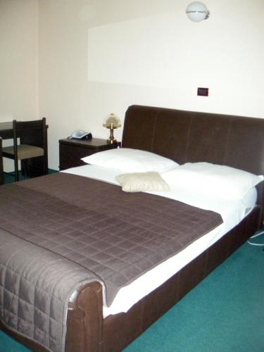 Postel nebo postele na pokoji v ubytování Hotel Zephyr - Plovanija