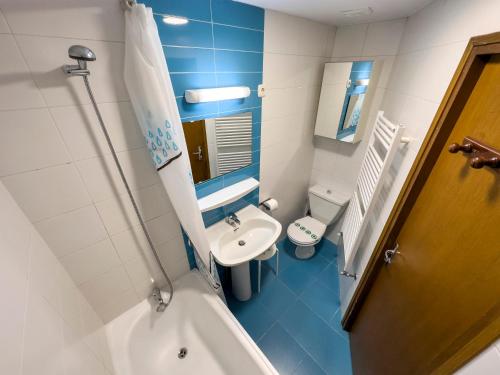 a small bathroom with a sink and a toilet at Grizzli Pedrous in Pas de la Casa