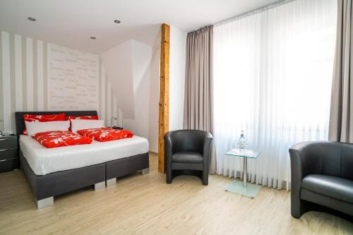 Кровать или кровати в номере Altstadt Hotel Cochem