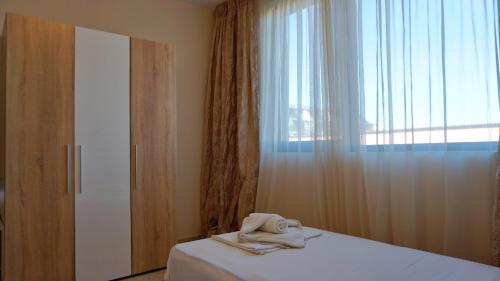 Ένα ή περισσότερα κρεβάτια σε δωμάτιο στο HC Apartments Kaliakria