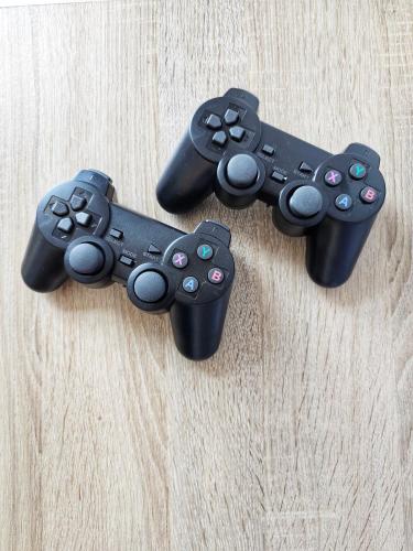 three video game controllers sitting on top of a table at Leisure Imperium Residence Studio Seaview Kuantan in Kuantan