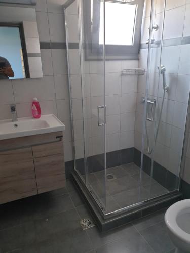 a bathroom with a shower and a sink at Brand new studio Sea View in Agia Pelagia