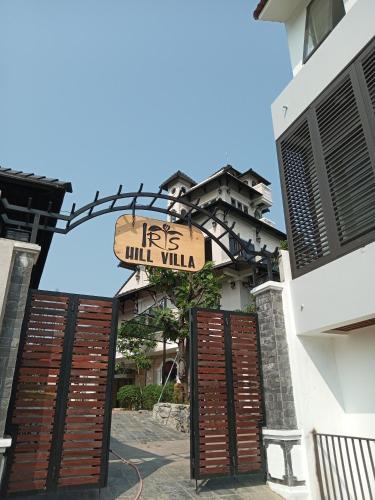 a building with a sign that reads its wild villa at IRIS HILL VILLA in Thôn Dương Xuân Hạ