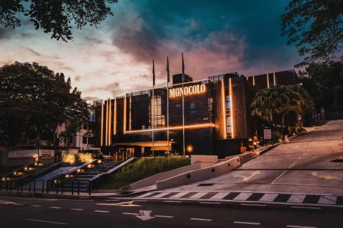 a building with a sign that reads málaga at Monocolo Boutique Hotel in Kota Kinabalu