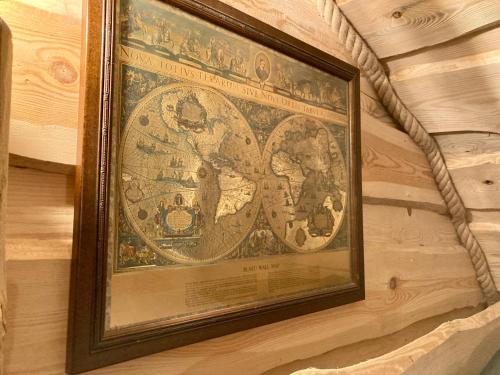 a framed picture of a map on a wall at The Prancing Moose in Ystrad Meurig