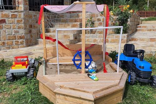 a playground with toys in a sandbox at Villa “Nadezhda” in Tsareva Livada