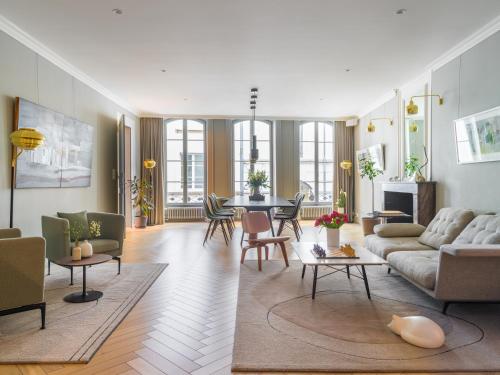a living room with a couch and a table at The Hamlet - Luxury Serviced Apartments in Geneva