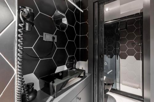 a bathroom with a sink and a mirror at 6 Apartment Galata in Istanbul