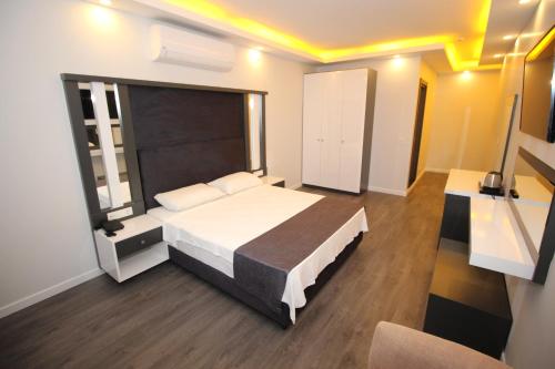 Postel nebo postele na pokoji v ubytování avsa extra vagant hotel
