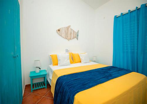 Postel nebo postele na pokoji v ubytování Appartamento Buzio. Stella Maris Exclusive