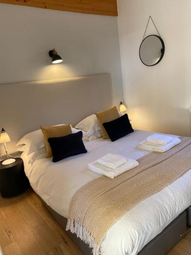 a bedroom with a bed with towels on it at Yorkshire Dales Lodge 5 by Together Travel - 3-Bed Family Retreat in Richmond