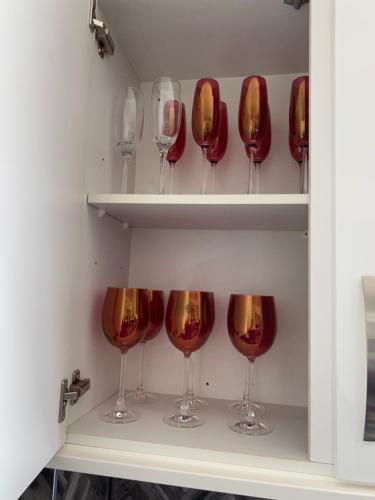 a row of wine glasses in a wine cellar at ARDUTHIE STREET in Stonehaven