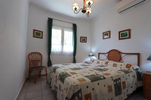 Postel nebo postele na pokoji v ubytování Villa Xoriguer