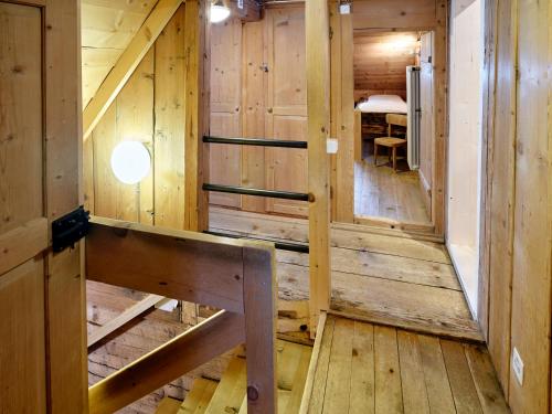 an inside view of a wooden cabin with a bench at Gästehaus Hof Maiezyt in Habkern
