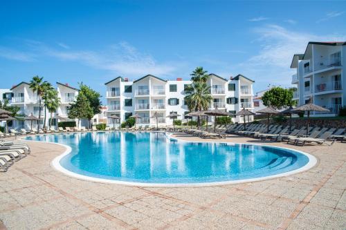 an image of a swimming pool at a resort at Pierre & Vacances Menorca Cala Blanes in Cala en Blanes
