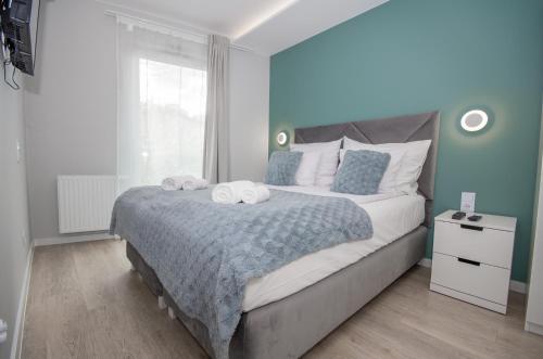 Ένα ή περισσότερα κρεβάτια σε δωμάτιο στο InPoint Apartments G11 near Old Town & Kazimierz District & Optional Paid Parking