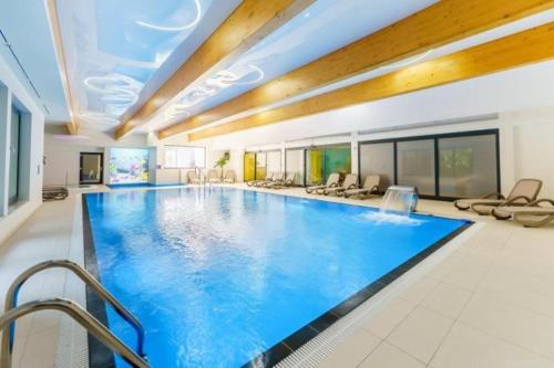 Bazén v ubytování Apartamenty Przy Morzu Dominikana nebo v jeho okolí