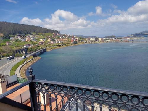 a view of a body of water from a balcony at MARINA SOL VIVEIRO in Viveiro