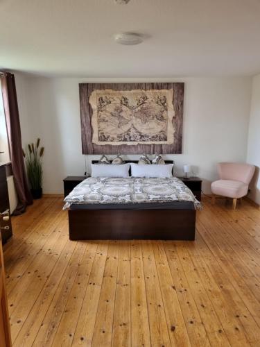 A bed or beds in a room at Ferienwohnung Editha mit Wintergarten
