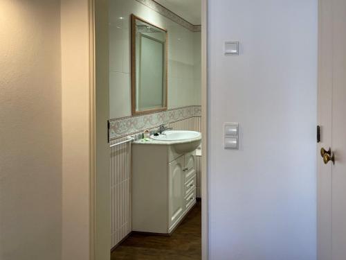 a bathroom with a sink and a mirror at Sofeelings, Estudio Sol, Baixa de Albufeira in Albufeira