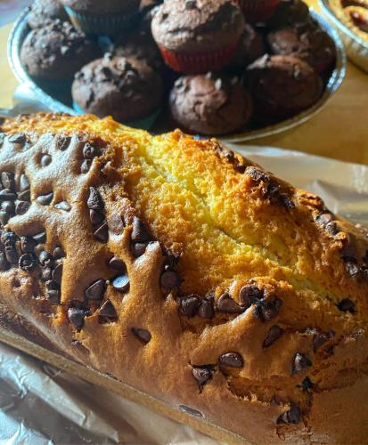 a loaf of pumpkin bread with chocolate muffins on a table at Agriturismo La Fattoria in Norcia