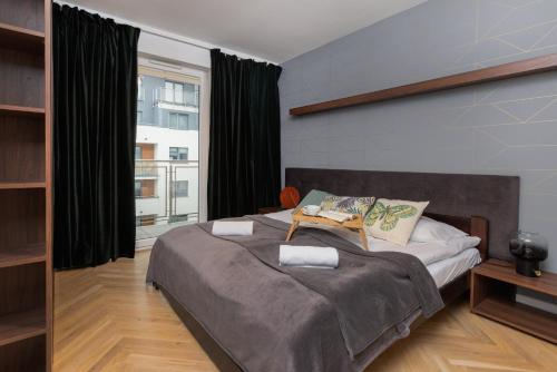Posteľ alebo postele v izbe v ubytovaní Olivia Business Centre Superior Apartment by Renters Prestige