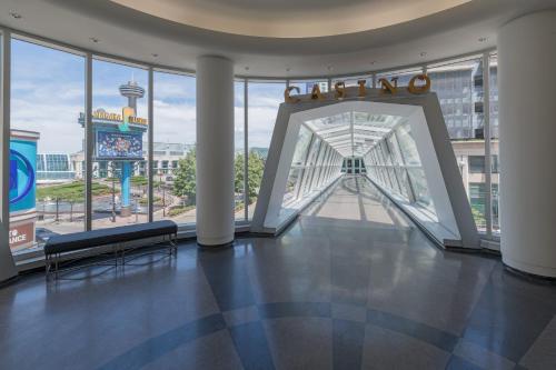 a lobby with a view of a building with windows at Wyndham Grand Fallsview Hotel in Niagara Falls