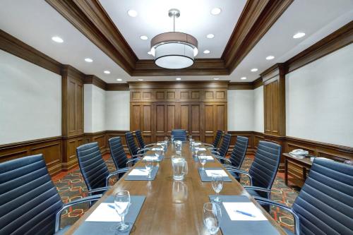 a large conference room with a long table and chairs at Wyndham Grand Fallsview Hotel in Niagara Falls