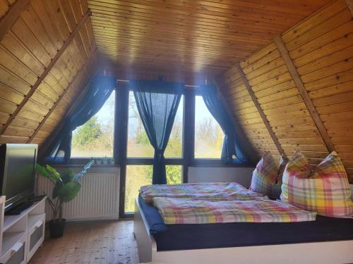 Katil atau katil-katil dalam bilik di Ferienhaus zum Sonnenblick