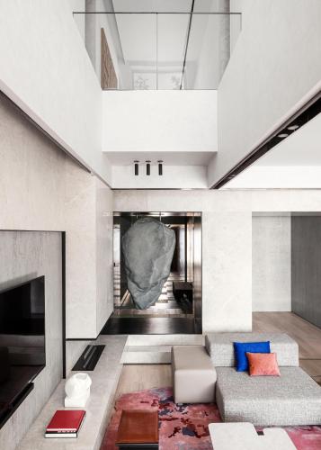 a living room with a couch and a fireplace at One&Only Portonovi in Herceg-Novi
