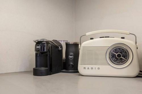 a toaster and a toaster next to a toaster at Lovely 2 bedroom unit in North Melbourne - 03068 in Melbourne
