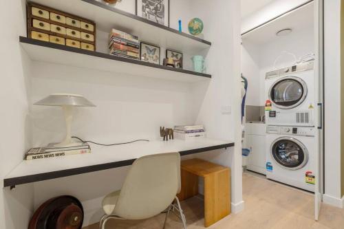 a home office with a desk and a chair at Lovely 2 bedroom unit in North Melbourne - 03068 in Melbourne