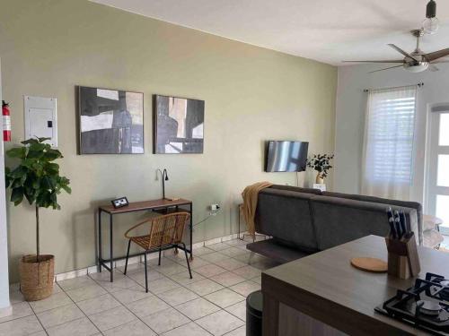 a living room with a couch and a table at The West Apartment in Stella