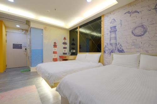 Ένα ή περισσότερα κρεβάτια σε δωμάτιο στο 85 Asia Hotel