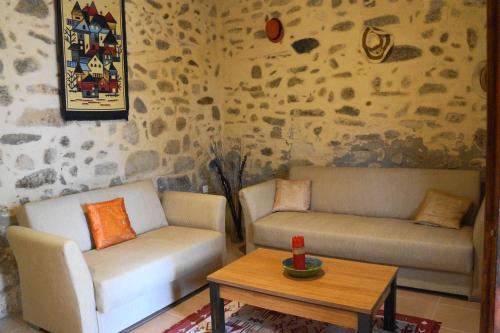 a living room with two couches and a coffee table at Casa Benavista in Kerásia