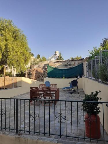 a patio with two benches and a skate park at Casa Benavista in Kerásia