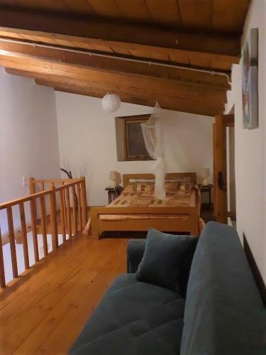 a living room with a couch and a bed at Casa Benavista in Kerásia