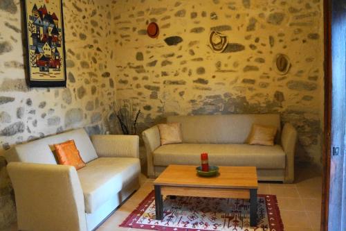 a living room with two couches and a coffee table at Casa Benavista in Kerásia