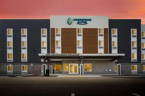 a rendering of the front of a building at WoodSpring Suites Grand Rapids Kentwood in Grand Rapids