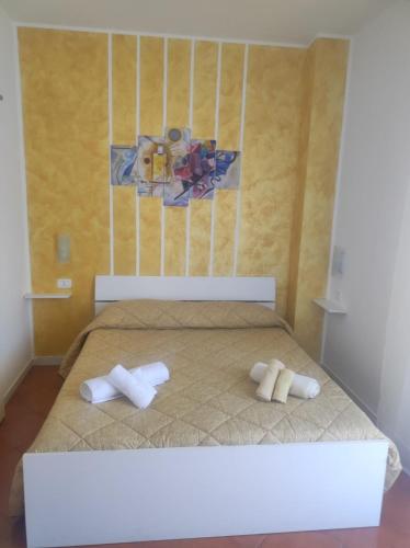 two towels on a bed in a room at B&b Cefalù in Cefalù