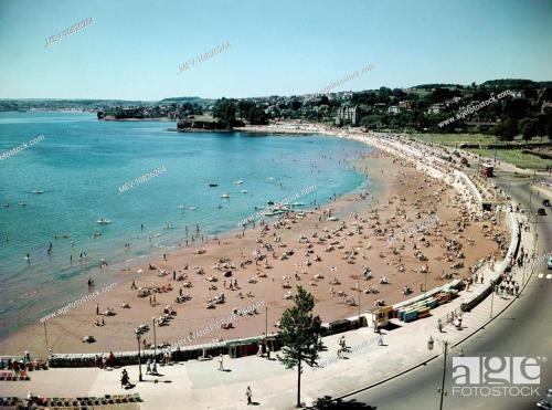 a view of a beach with people on it at Sandybanks Torquay - Seaview and Promenade Apartments in Torquay